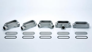 Row of aluminum conduit bodies in LB, LL, LR, T and C shapes with covers | Conversions Tech