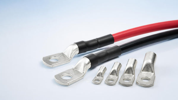 Tin-plated copper lugs crimped on red and black battery cables | Conversions Tech