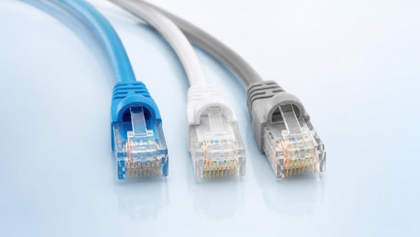 Blue, white and gray ethernet patch cables with RJ45 connectors | Conversions Tech