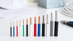Row of stripped copper and aluminum building wire in ascending gauges | Conversions Tech
